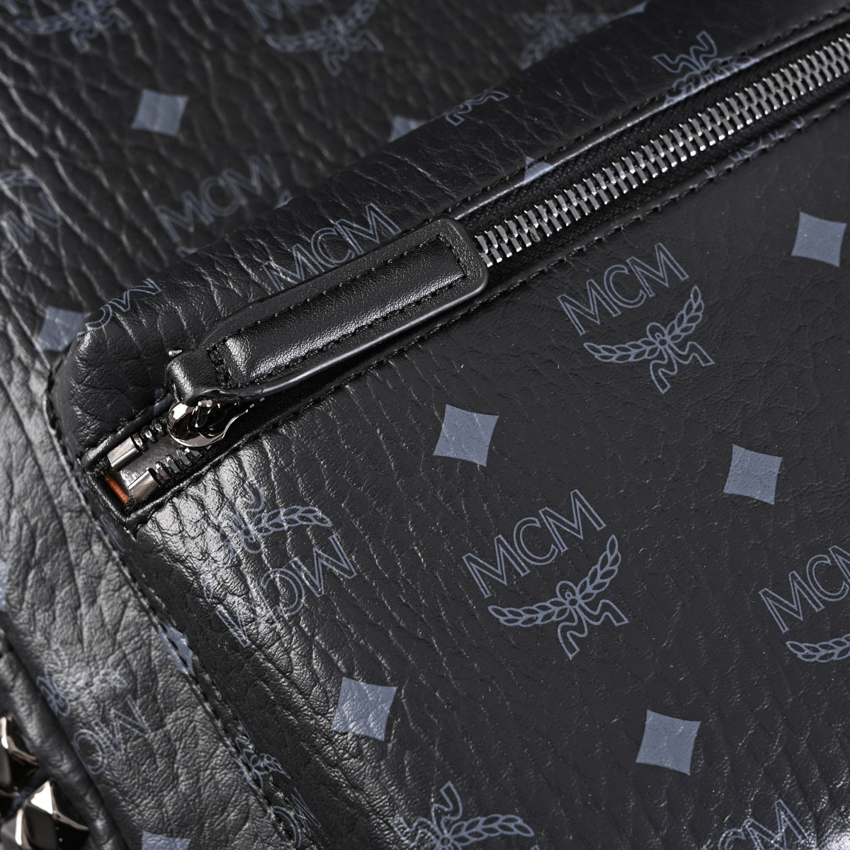 MCM Stark Visetos Medium Backpack – Black Monogram with Studded Detailing